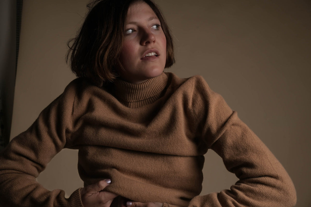 Minna is 5'8", a size 10 and wears a Small jumper