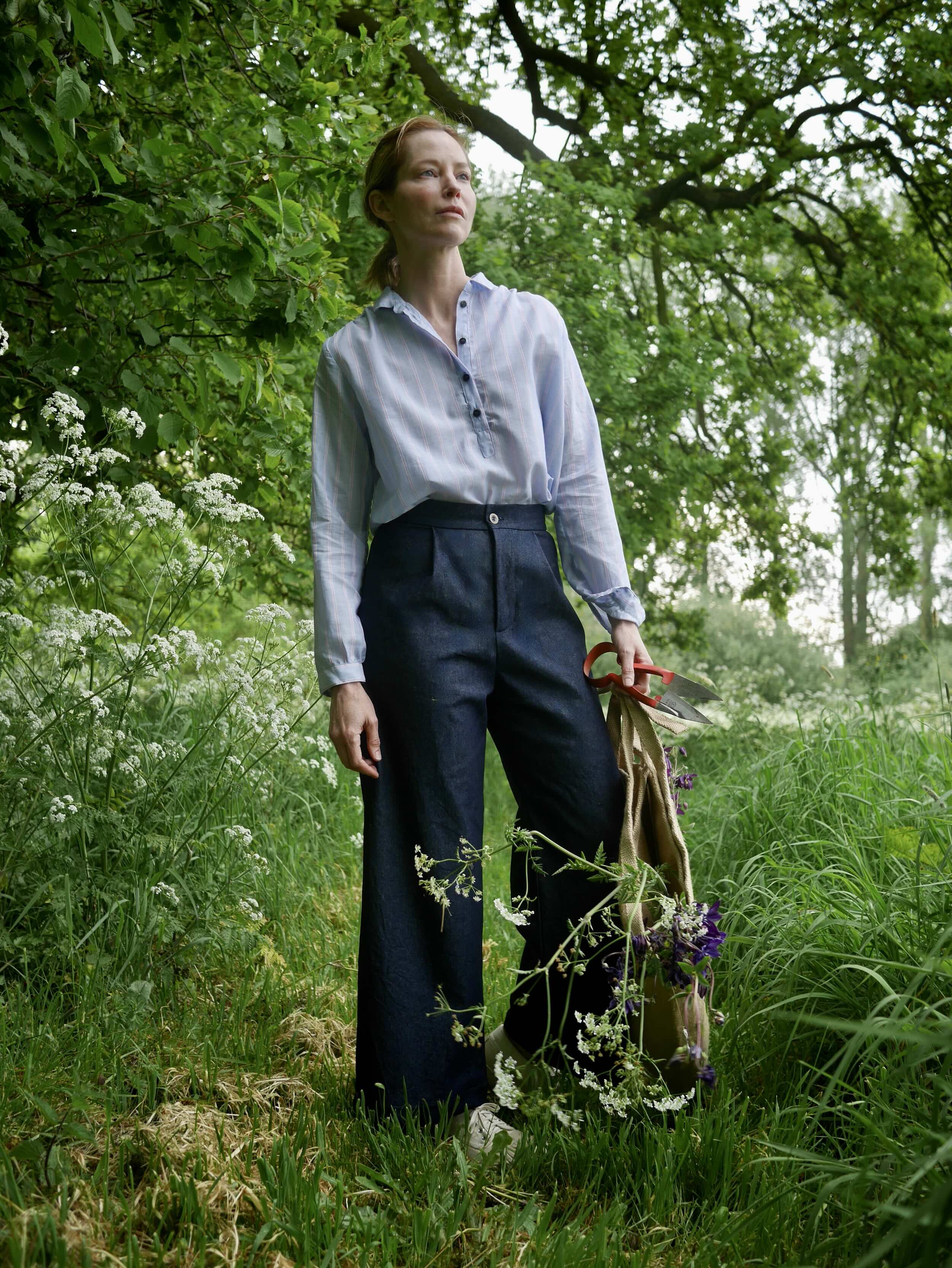 Sienna wears Carrier Company Sailor Trouser in Indigo Denim with Lightweight Pullover Shirt - Sienna is 5'6", a size 10 and wears Small trousers