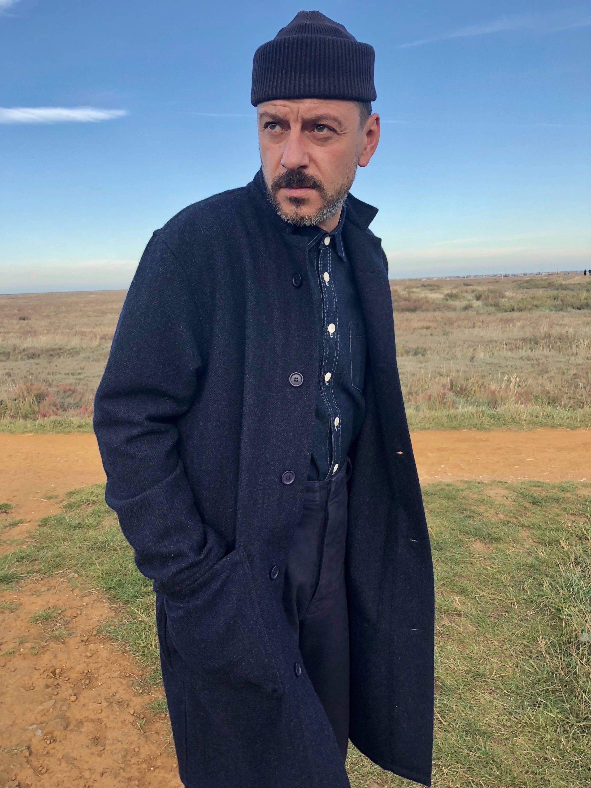 Enzo is 6'1" and wears a Large coat