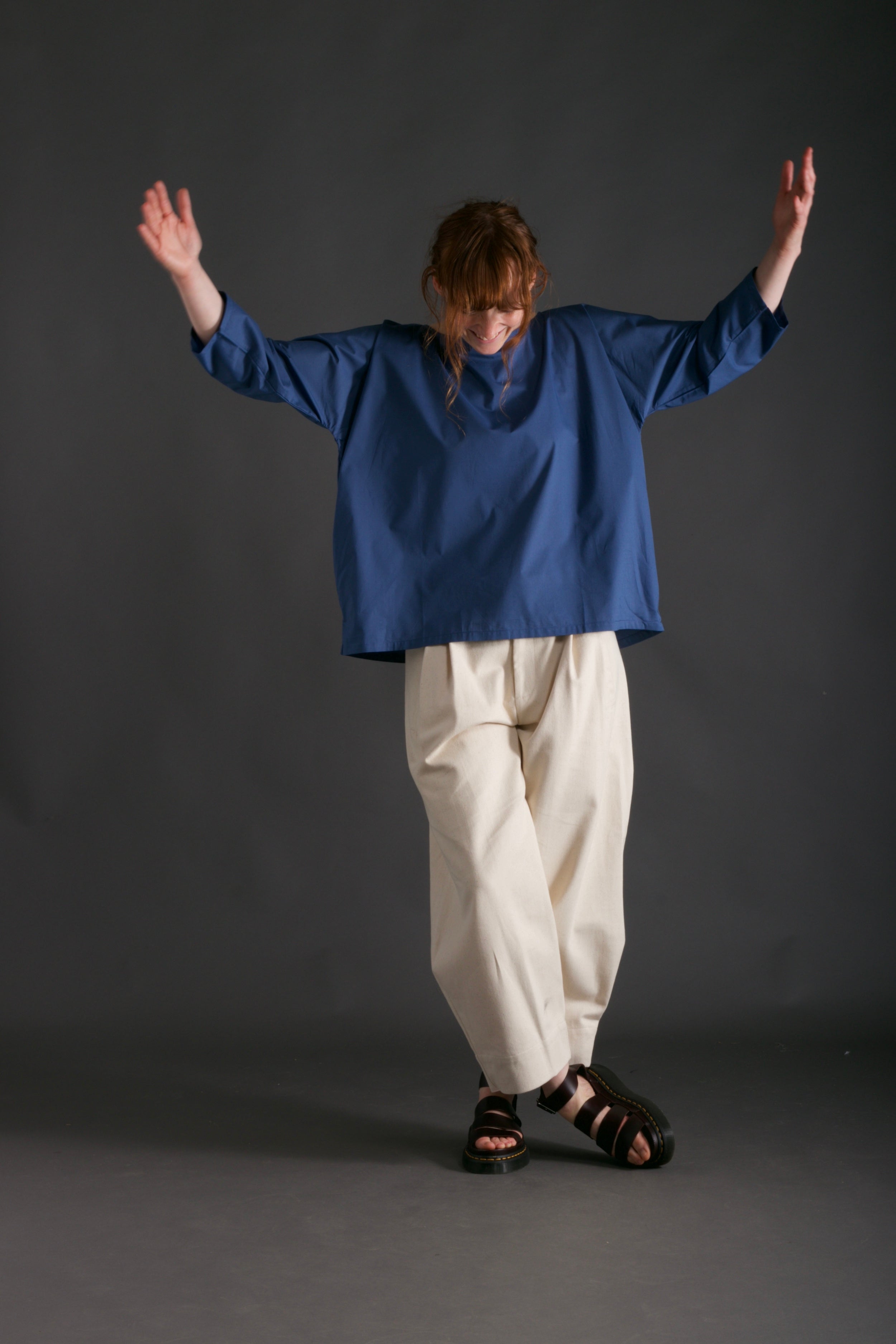 Woman wears Carrier Company Dutch Trouser in Seeded Denim with Cotton Tee Shirt