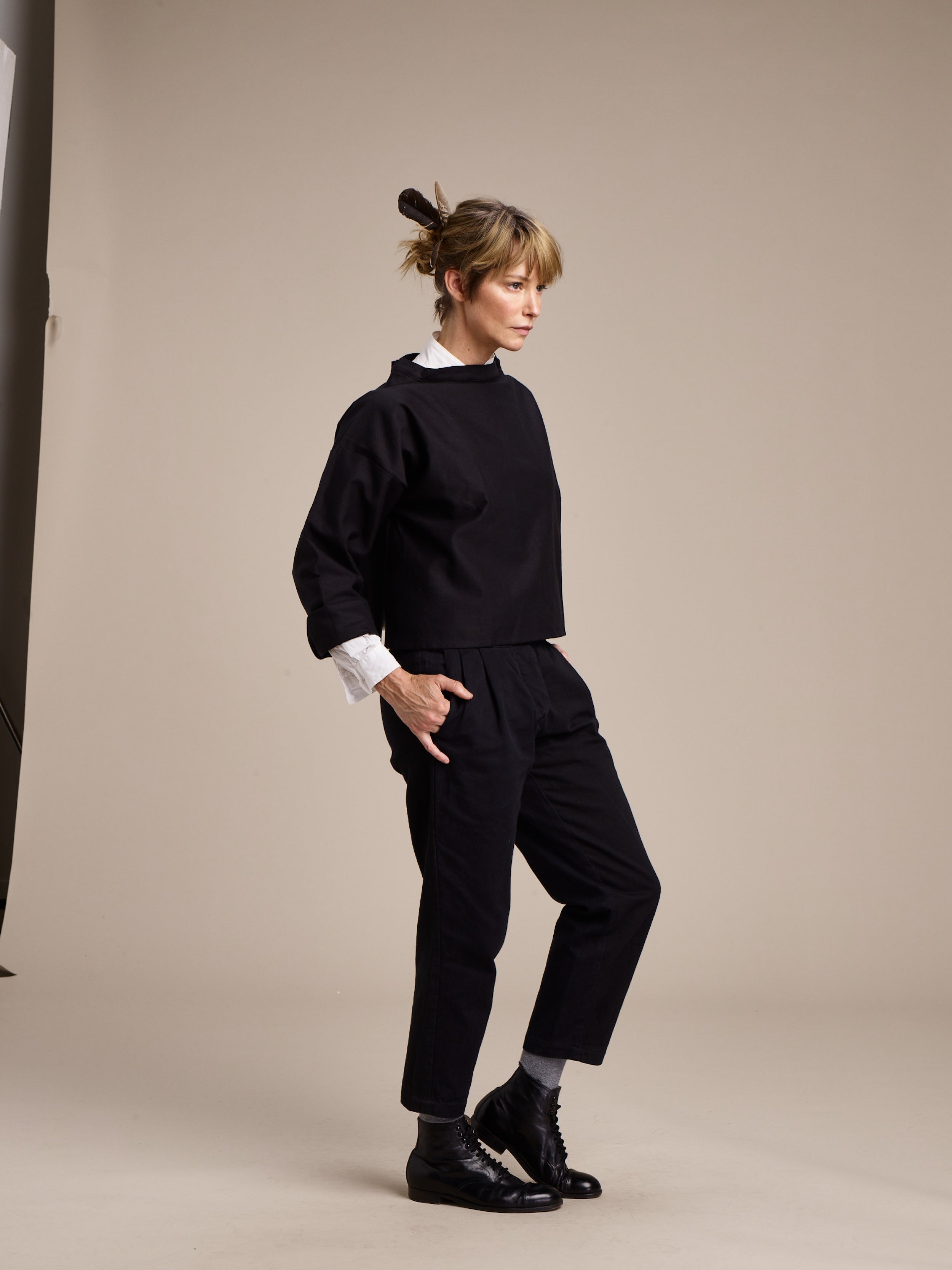Woman wears Carrier Company Cropped Smock in Black with Cropped Trouser